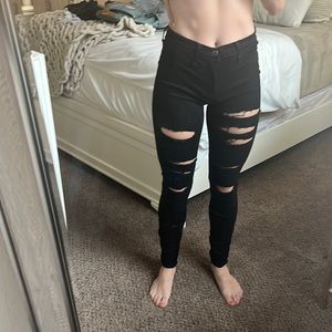 Vibrant black ripped jeans stretchy worn one time. High waisted